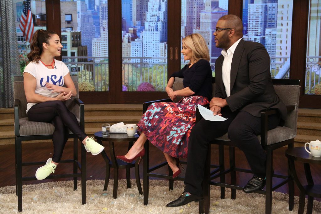 Kelly Ripa and Tyler Perry talk with Aly Raisman during the production of "Live Kelly" in New York on Tuesday, Oct. 11, 2016. Photo: David M. Russell//Disney/ABC Home Entertainment and TV Distribution ©2016 Disney ABC. All Rights Reserved.